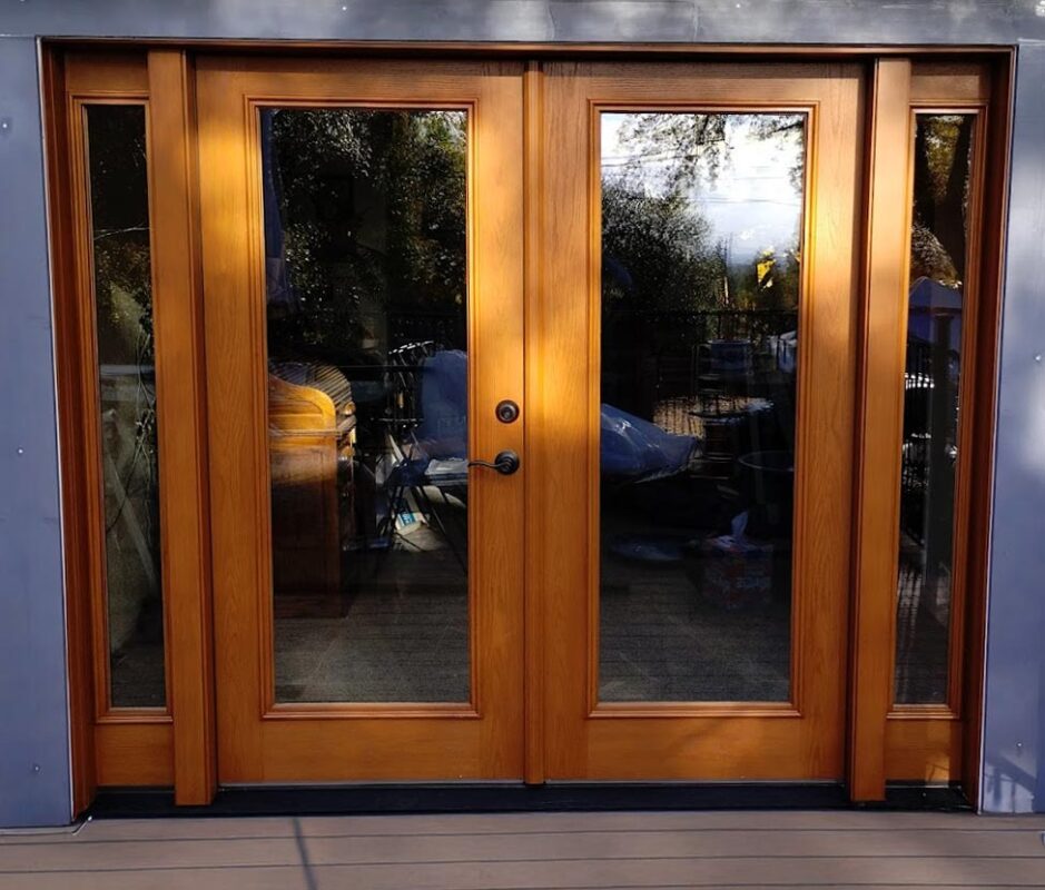 Custom wood French patio doors with energy-efficient glass, installed in a Sacramento home for enhanced style, insulation, and natural light.