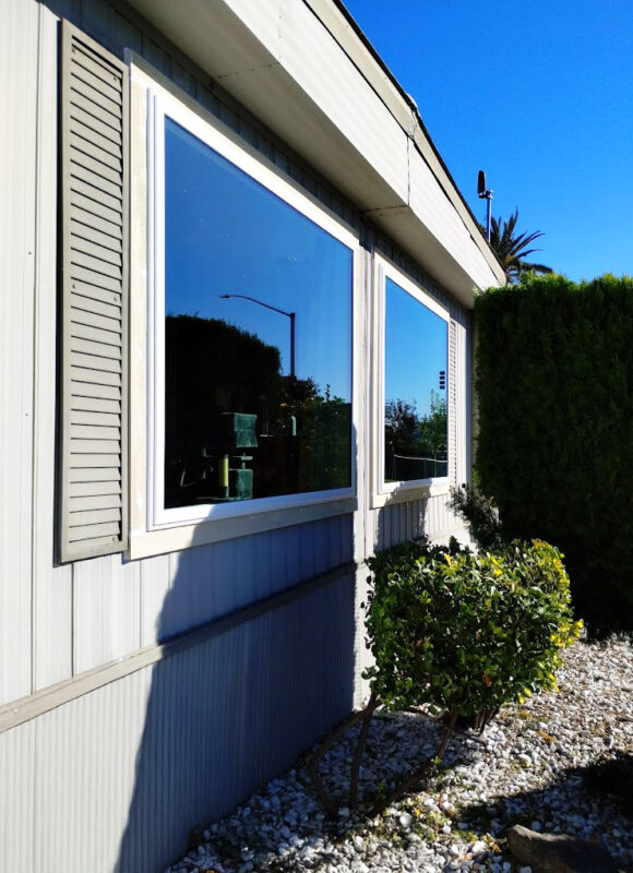 Large energy-efficient picture windows with double-pane, low-E glass installed in a Sacramento mobile home for enhanced insulation, natural light, and panoramic outdoor views.