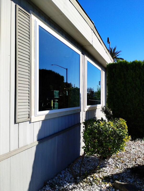 Large energy-efficient picture windows with double-pane, low-E glass installed in a Sacramento mobile home for enhanced insulation, natural light, and panoramic outdoor views.