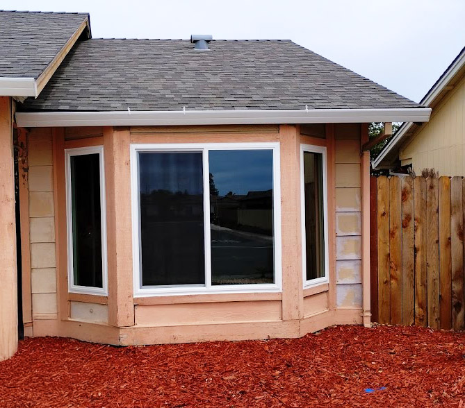 Custom bay window installation in Sacramento featuring a center picture window with operable casement side windows, designed for energy efficiency, natural light, and improved ventilation.